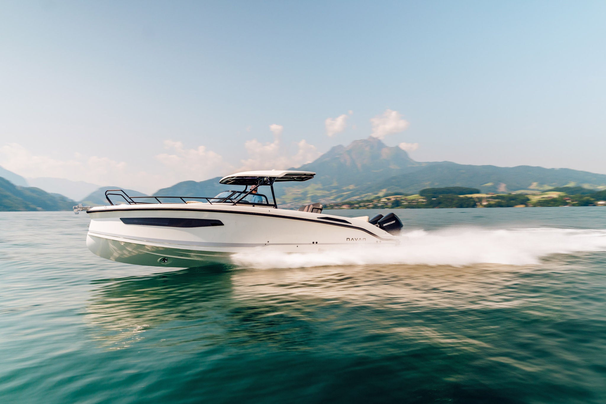 NAVAN S30 on the open water with mountians in the background