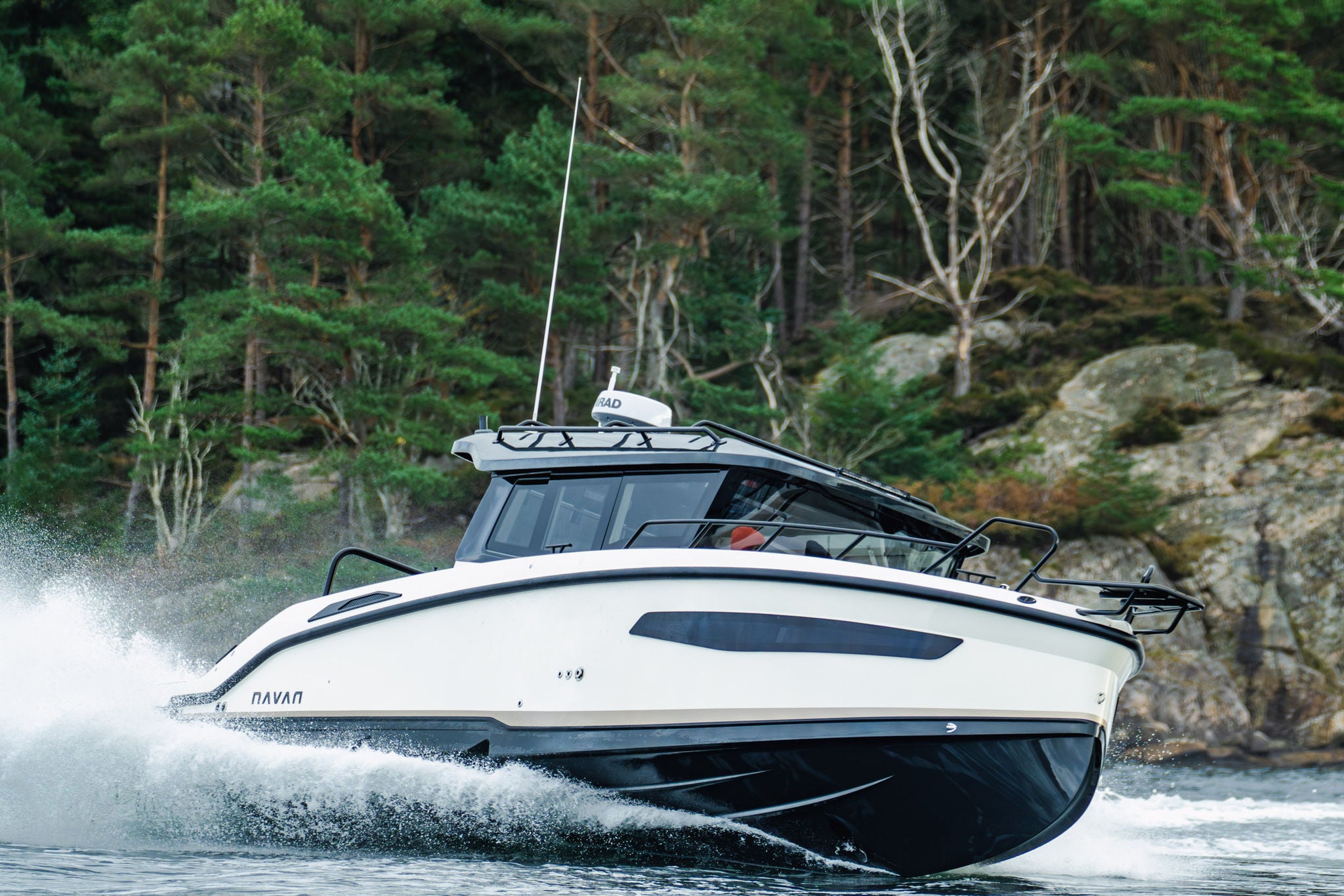 A NAVAN C30 createing huge wakes on the water