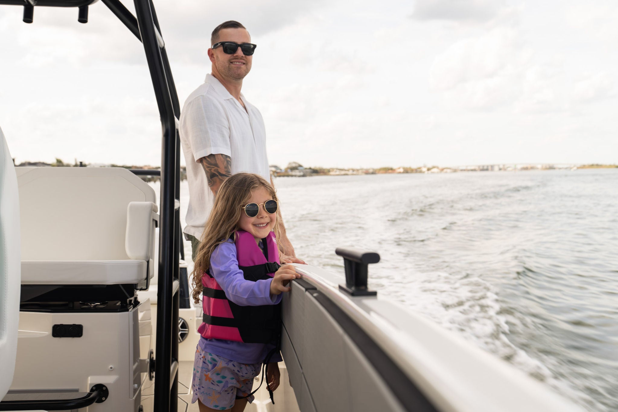 A family watching what's ahead on the water from the side of the NAVAN T30